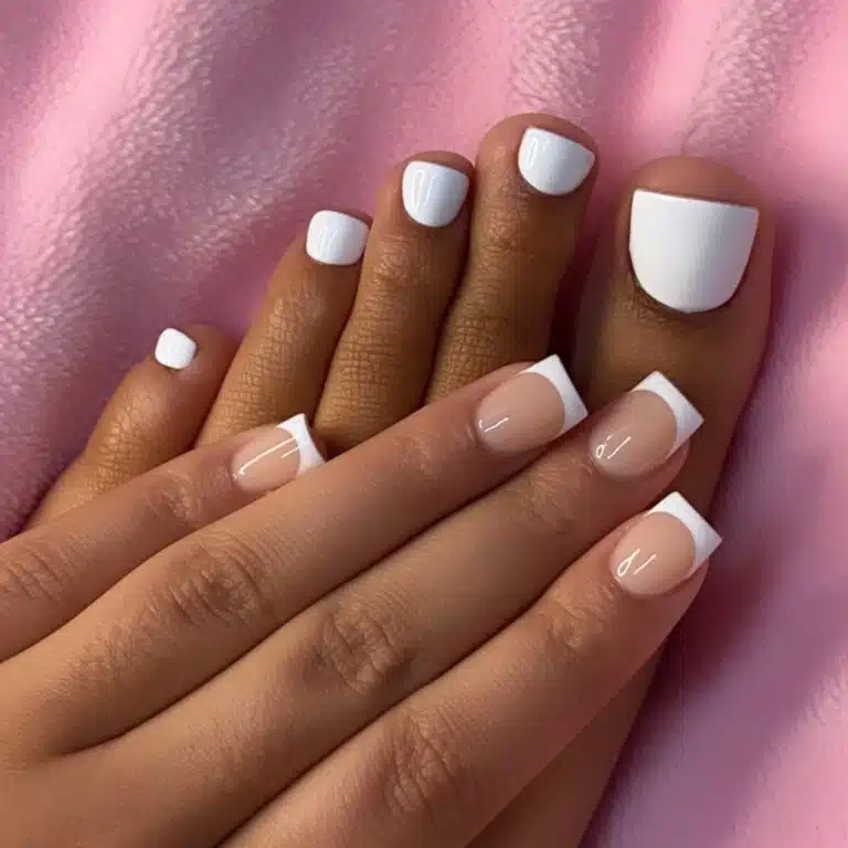 Classic white toe tips with glossy square toenails on a soft pink towel.