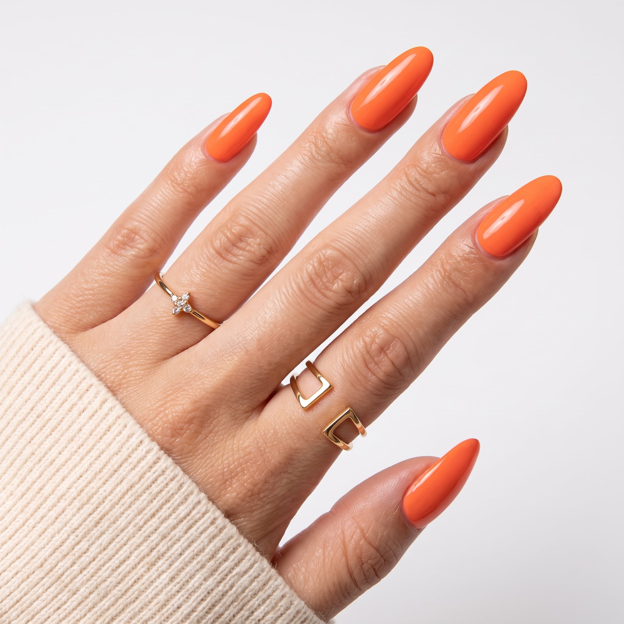 Simple Coral Summer Nails with glossy bright coral polish on almond nails