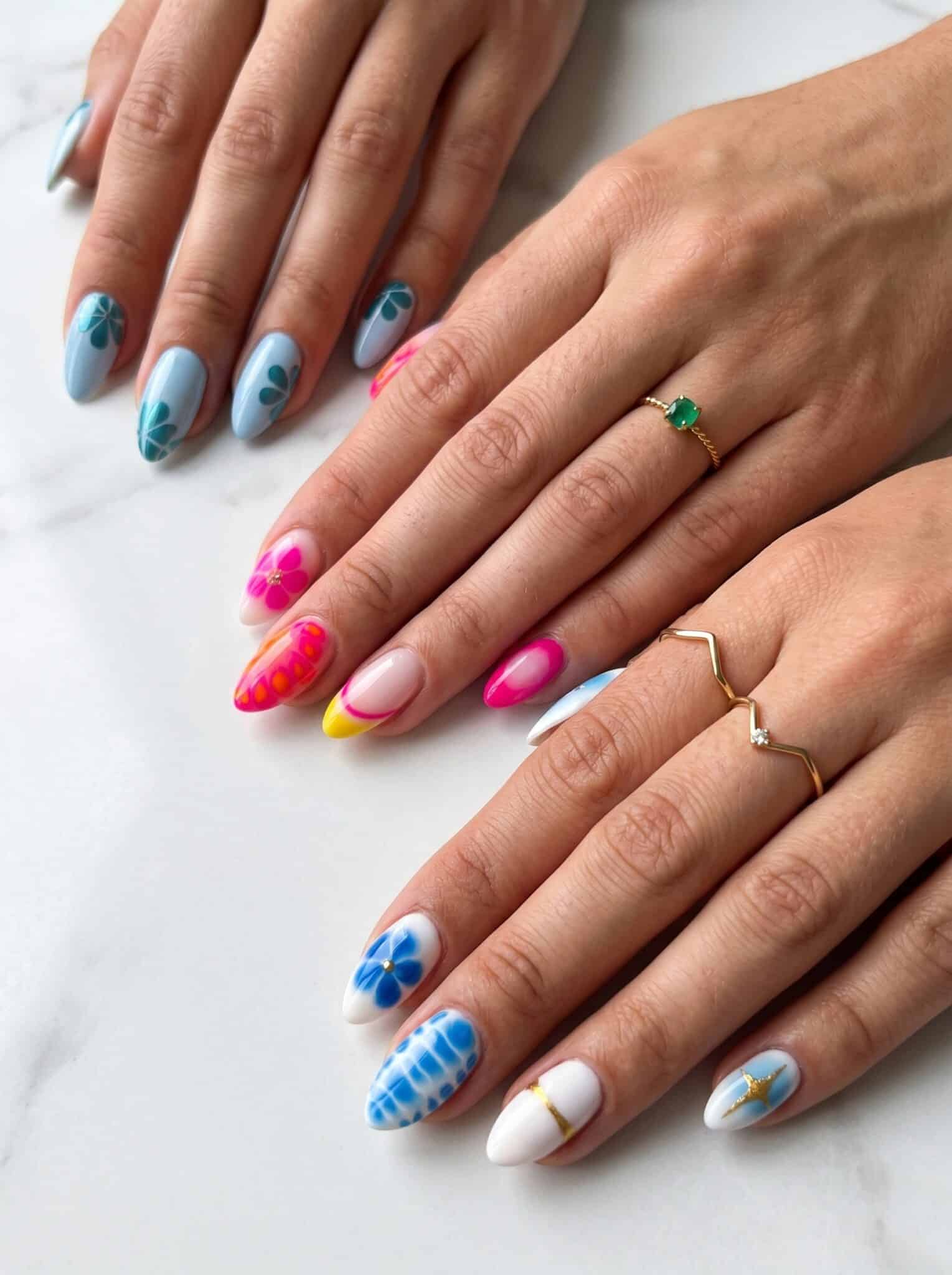 Short nails with bright blue pink and yellow French tip details