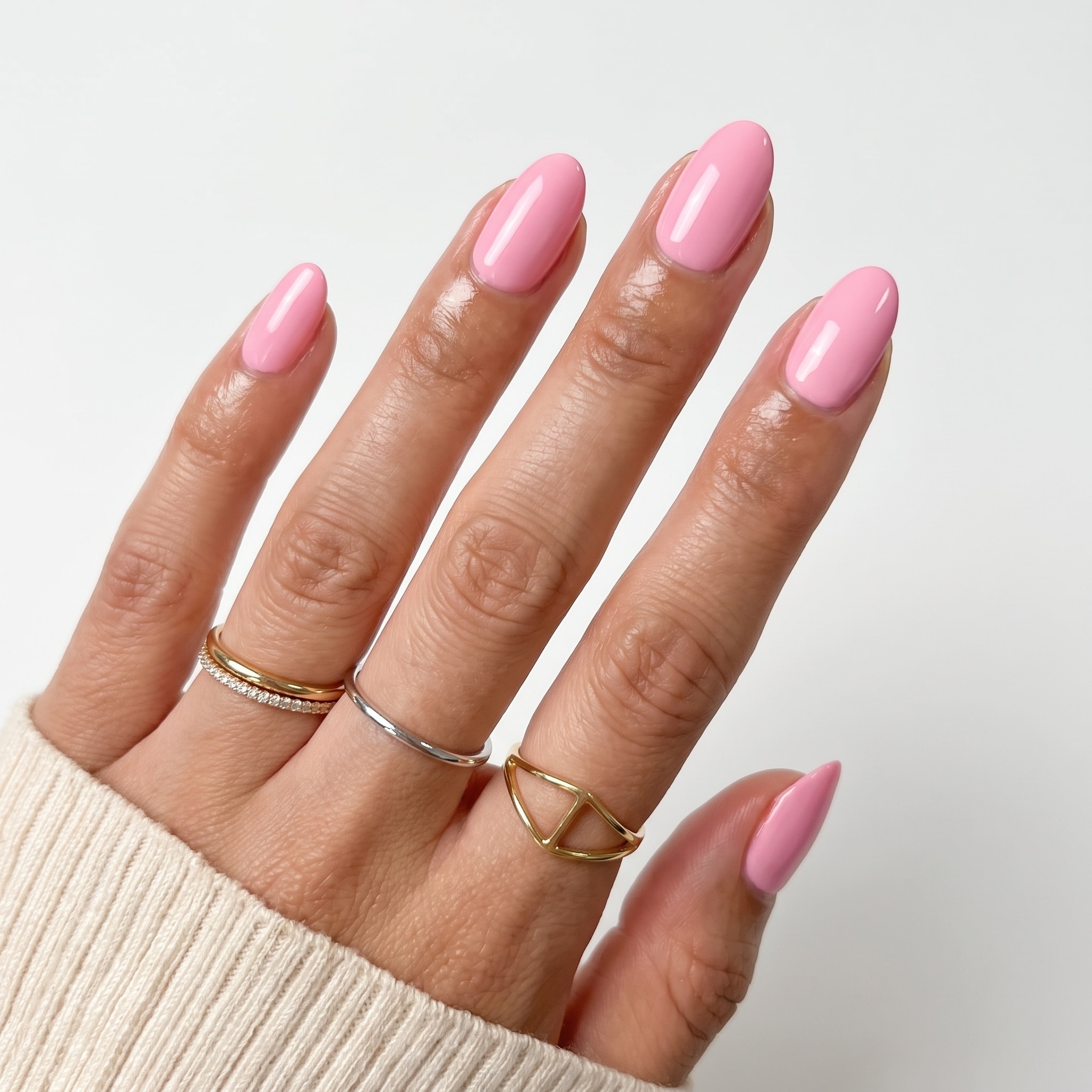 Glossy bubblegum pink almond nails on both hands