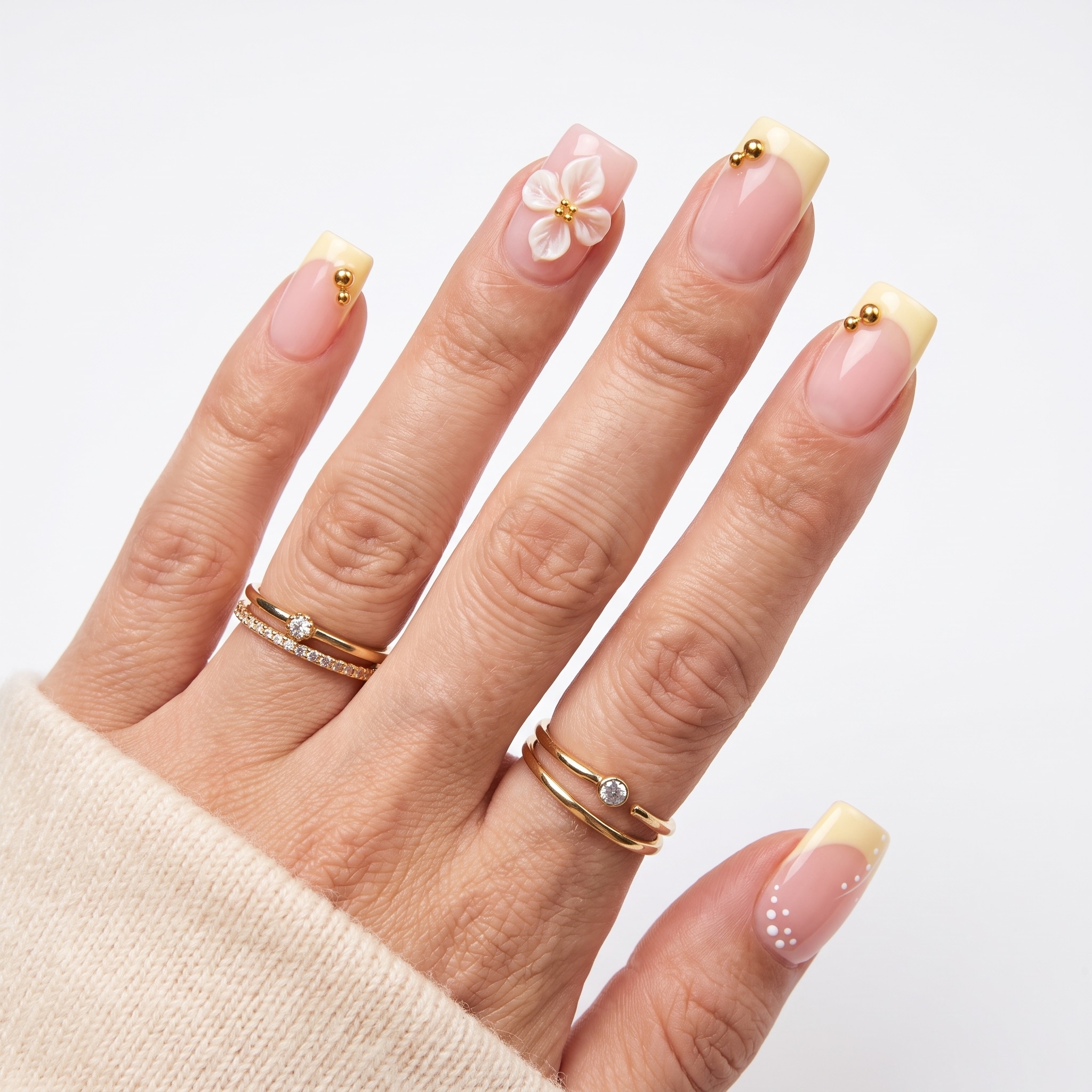Simple Yellow Summer Nails with butter yellow French tips and tiny floral accents