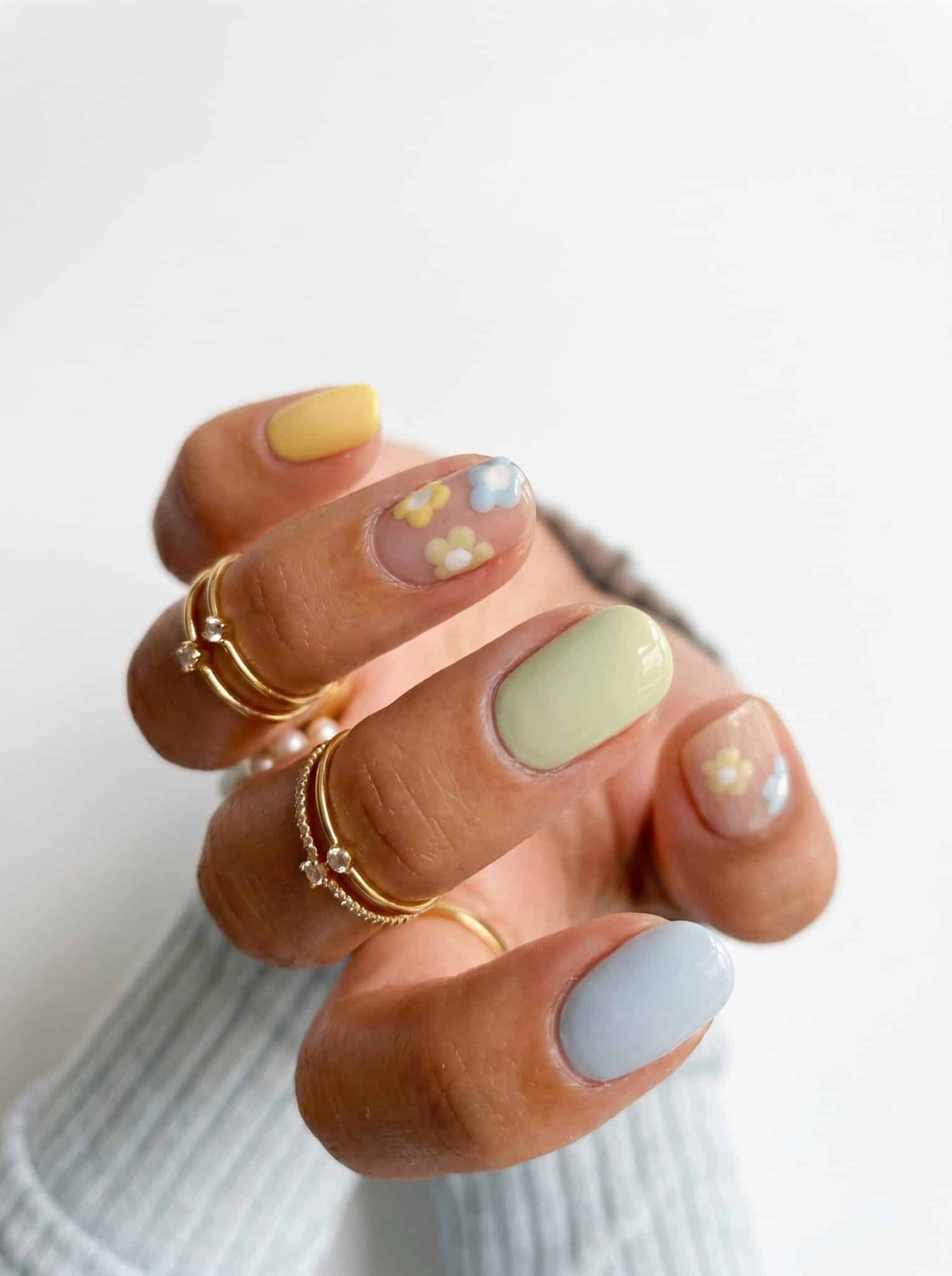Pastel nails in butter yellow, powder blue, mint green, and soft pink