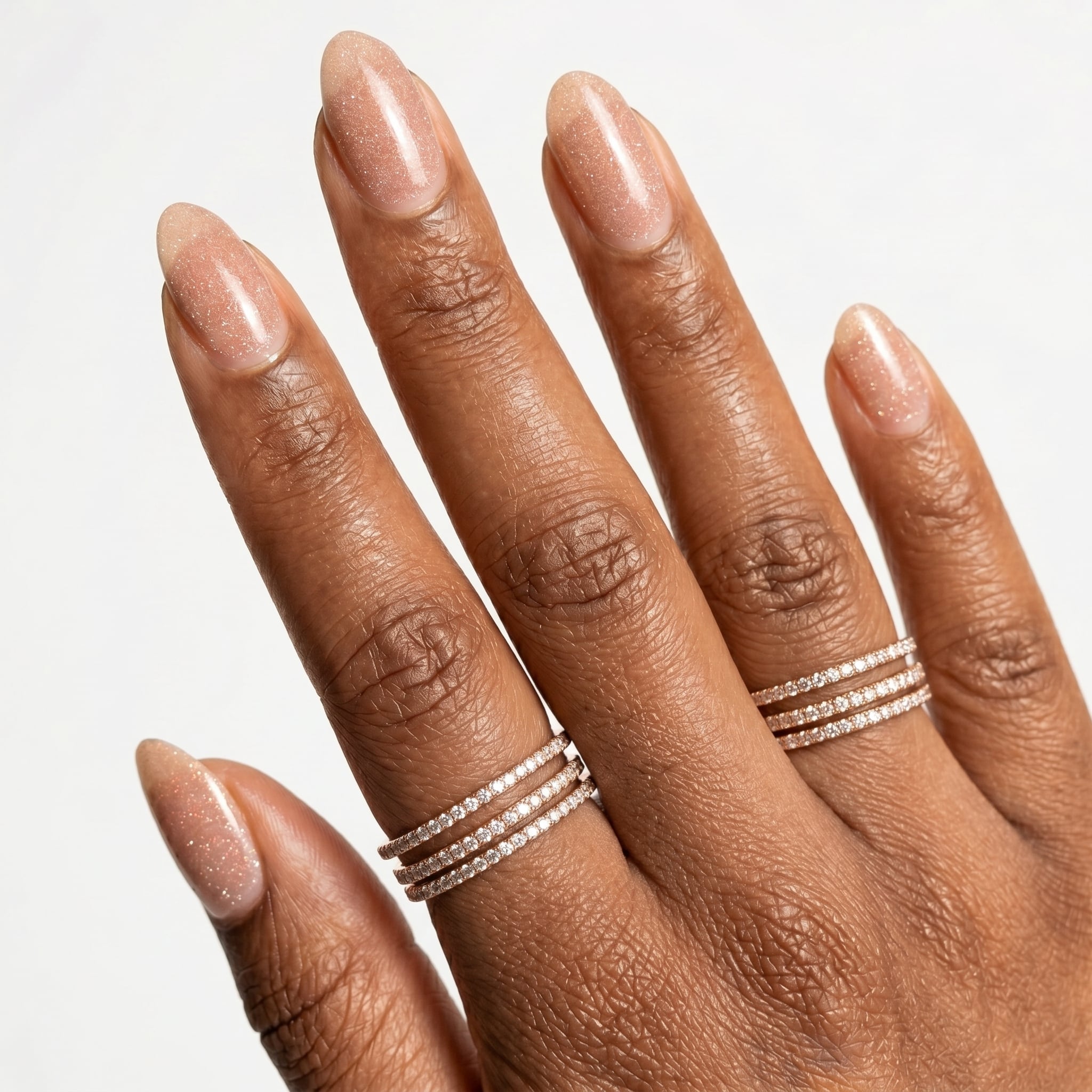 Nude almond nails with fine white French tip details