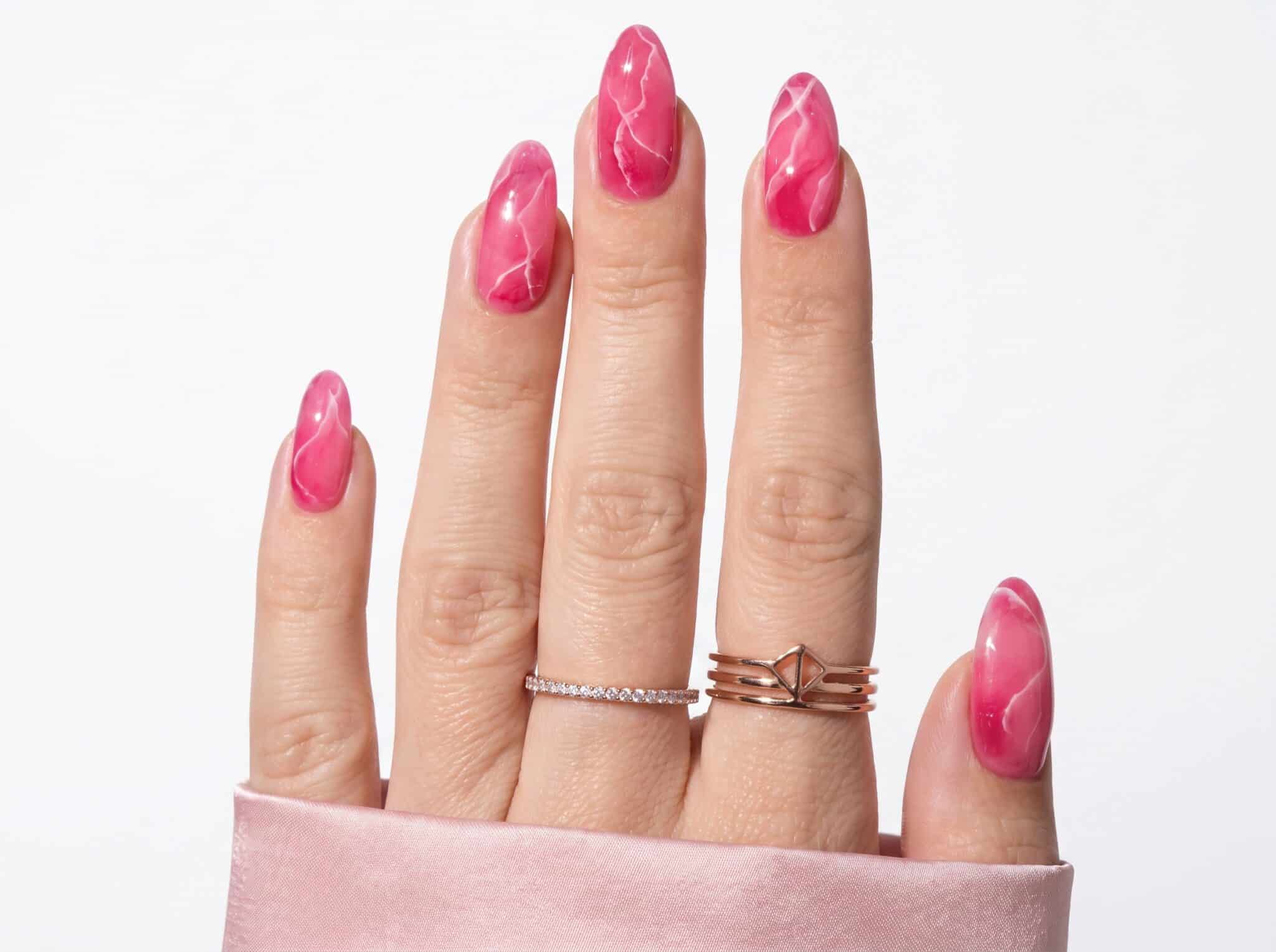 Nude nails with coral pink outline French tip details