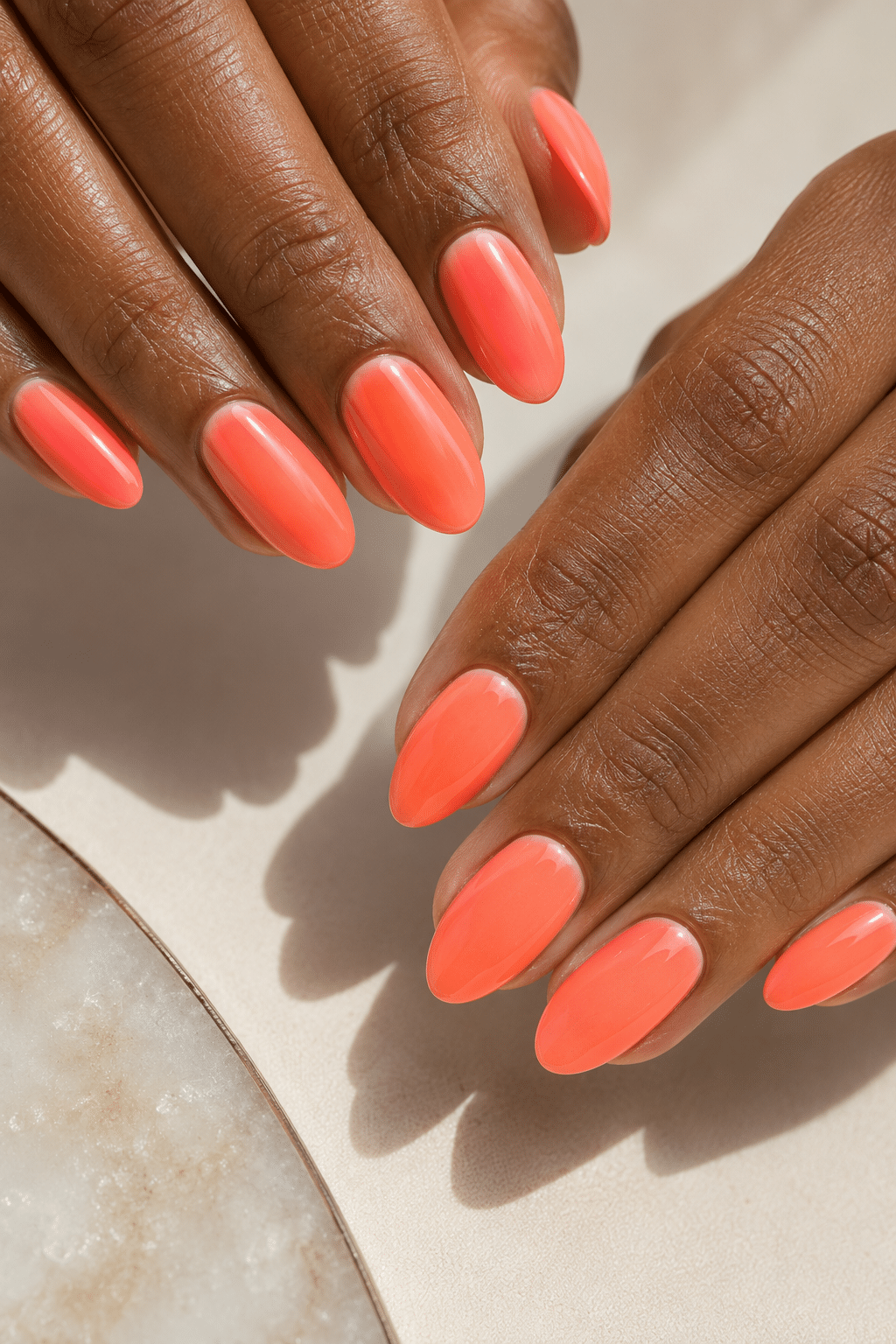 Coral sunset swirl nails with white and orange accent details