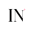IdeasNail IN favicon with a small pink sparkle on a white background