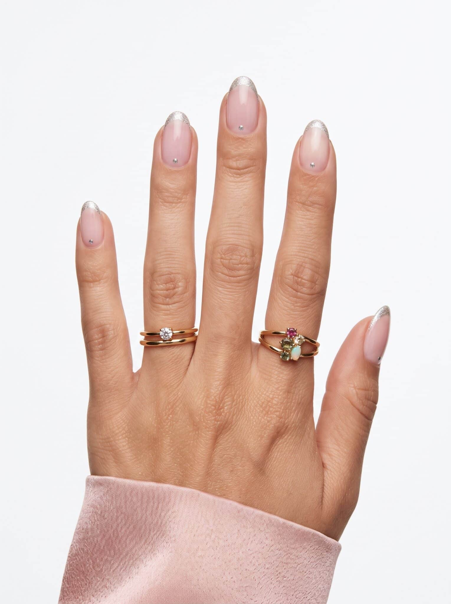 Fruit-inspired summer nails with orange cherry and striped accent details