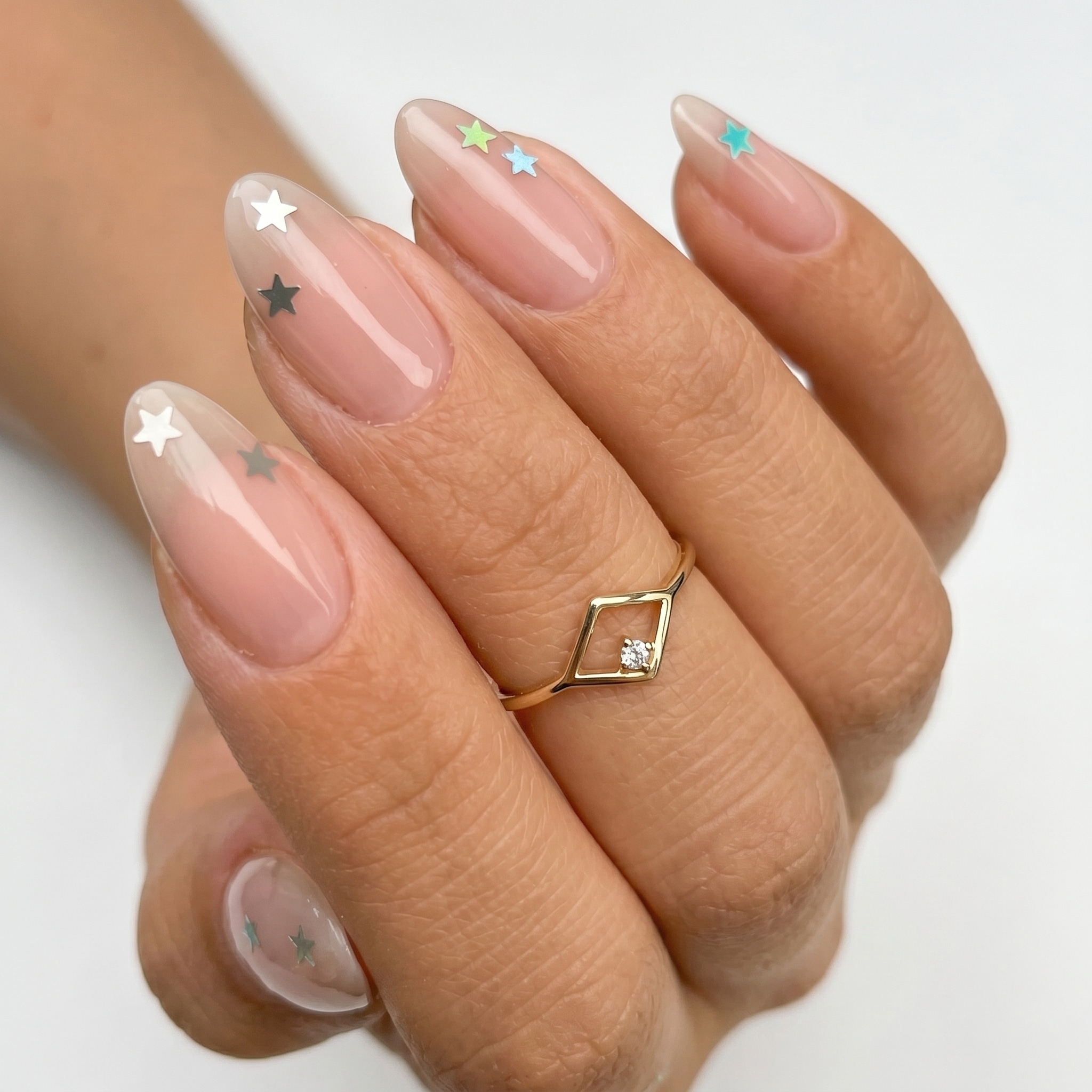Nude nails with delicate gold outline French tip details