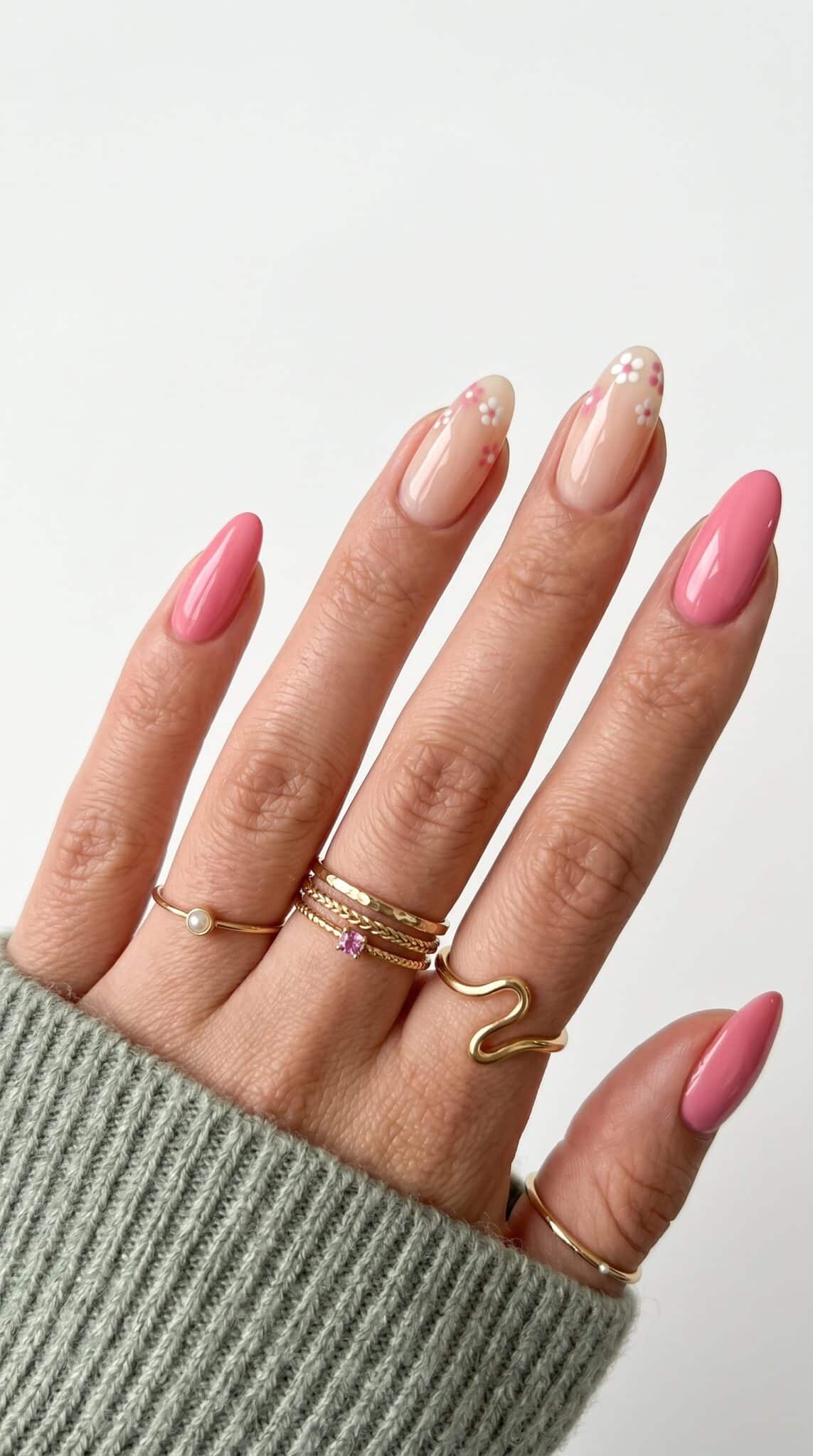 Simple Pink Summer Nails with hot pink polish, white floral accents, and colorful abstract nail art