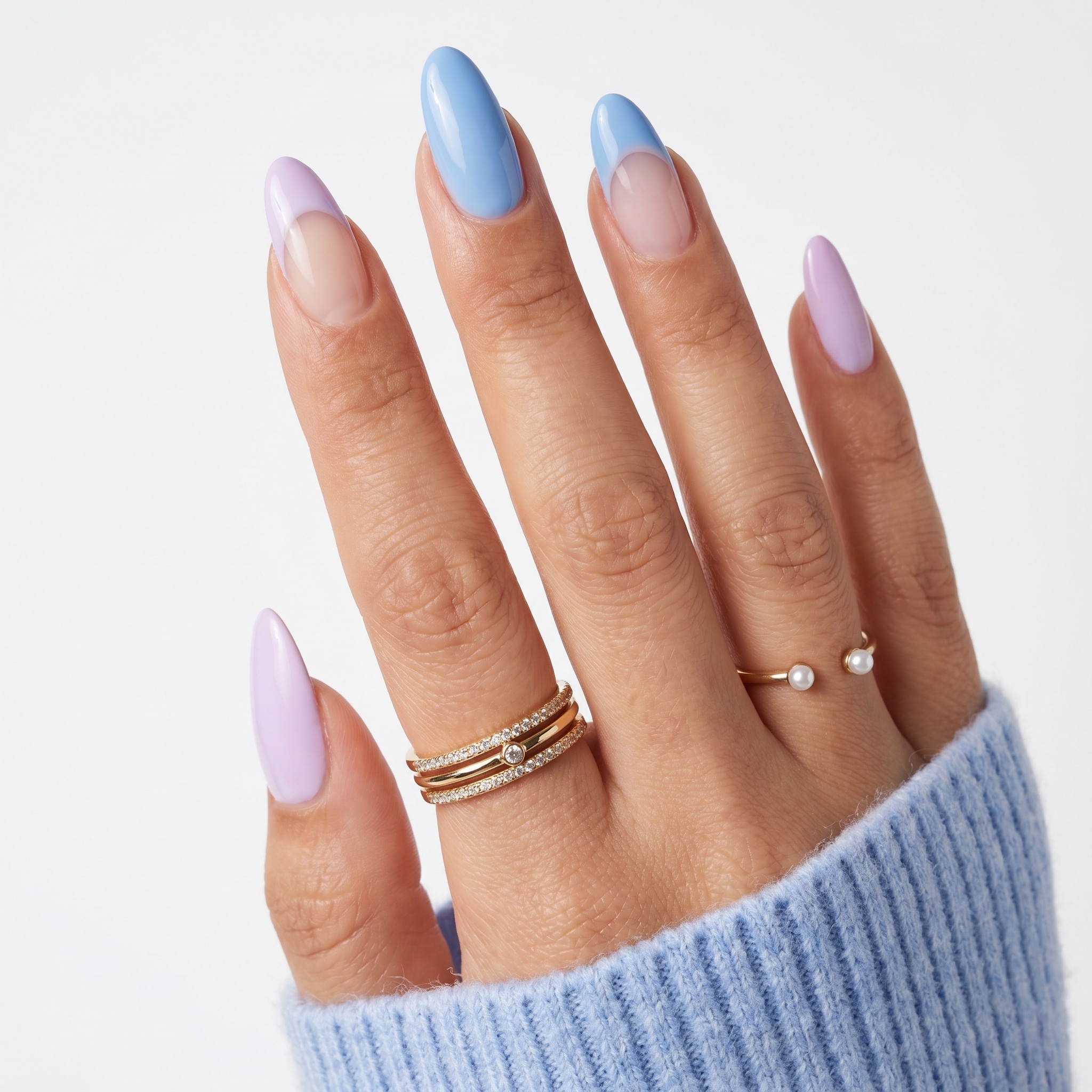 Pastel nail art with blue florals, pink details, and colorful summer accents