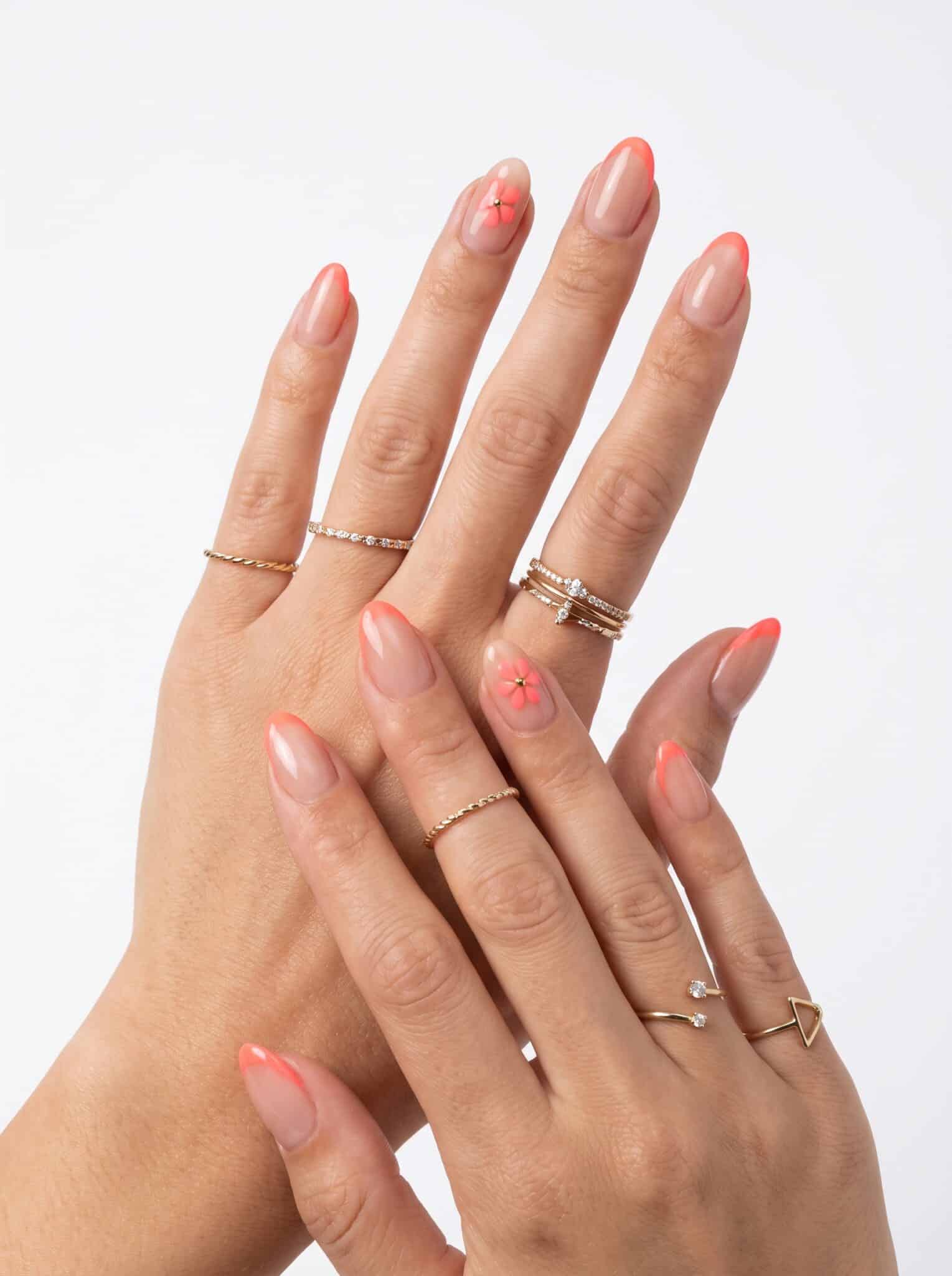 Peach coral almond nails with a rose-gold glitter accent nail