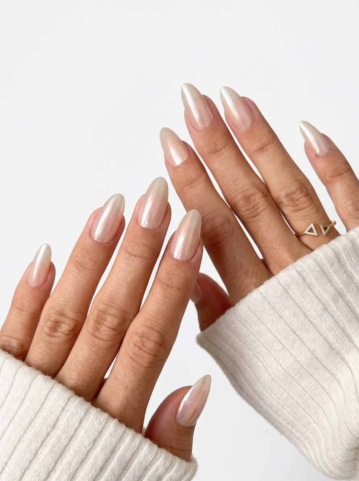 Sheer taupe nude almond nails with a natural glossy finish