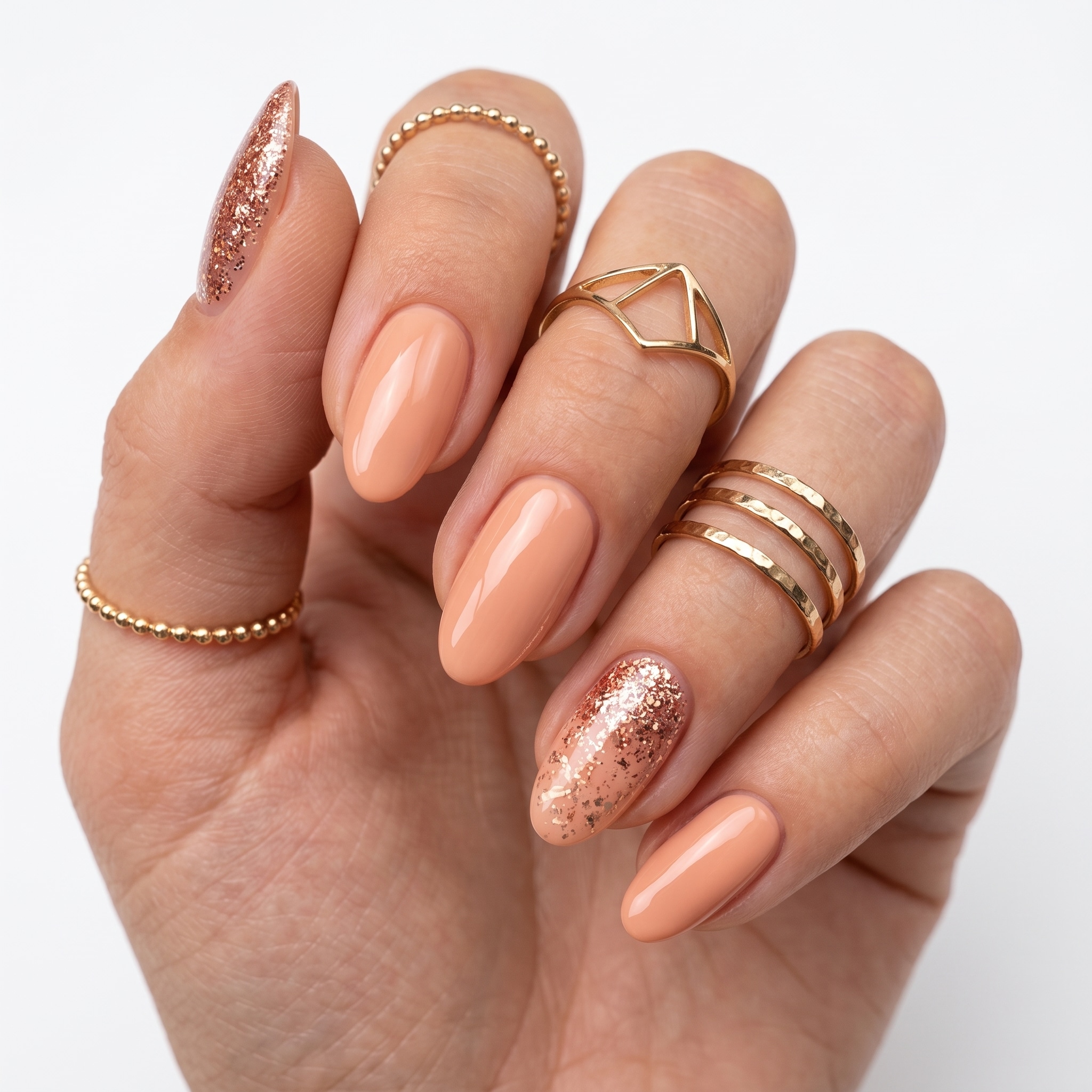 Soft coral and nude nails with a glossy minimal finish