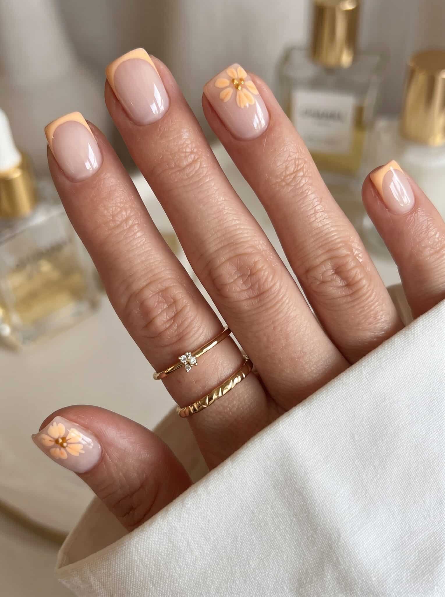 Minimal peach nude almond nails with a glossy finish and simple salon-style look