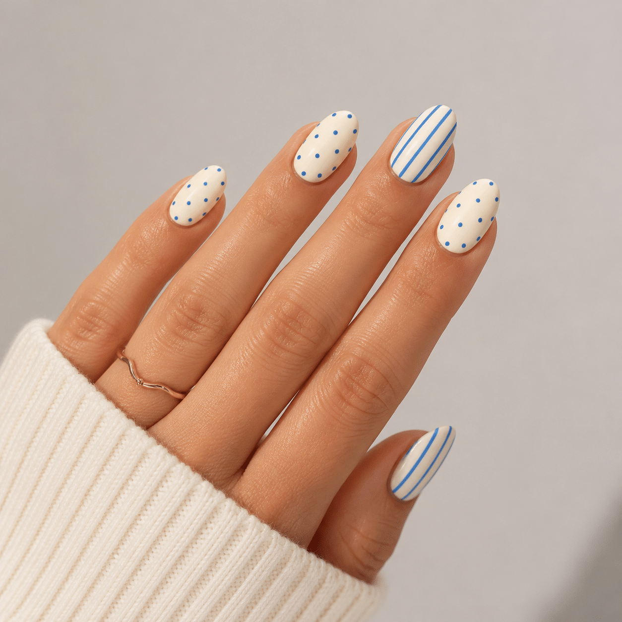 Square nail ideas with elegant white nail art and a glossy nude base