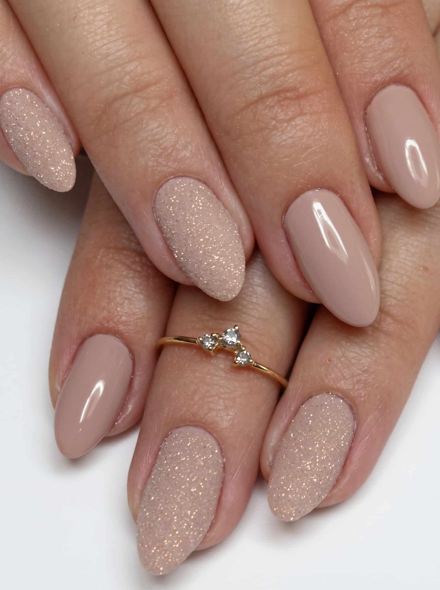 Taupe nude nails with champagne glitter accent nails