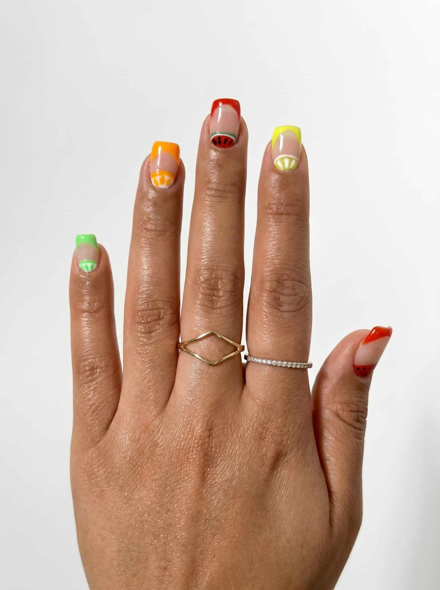 Short nails with tropical green yellow orange and red French tips