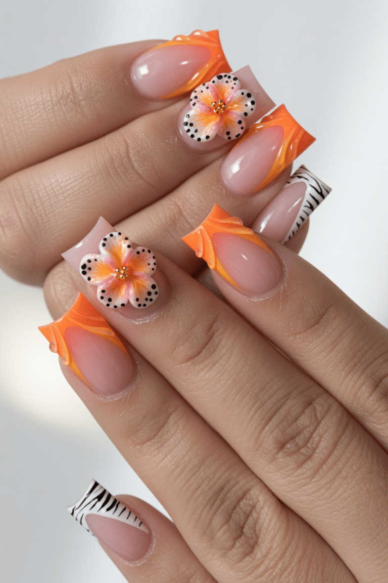 Orange tropical flower summer nails with glossy floral accents on almond nails