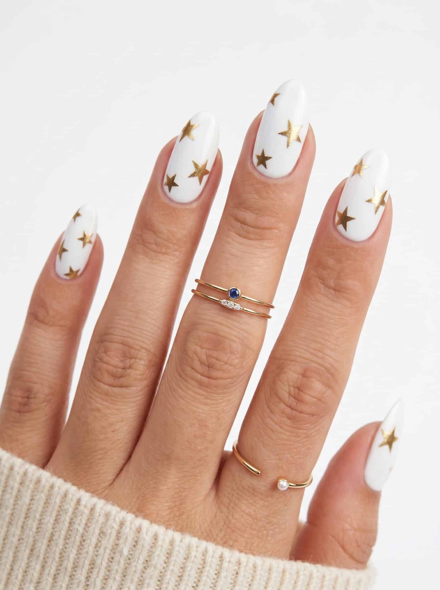 Simple White Summer Nails with white micro French tips and tiny black flower accents