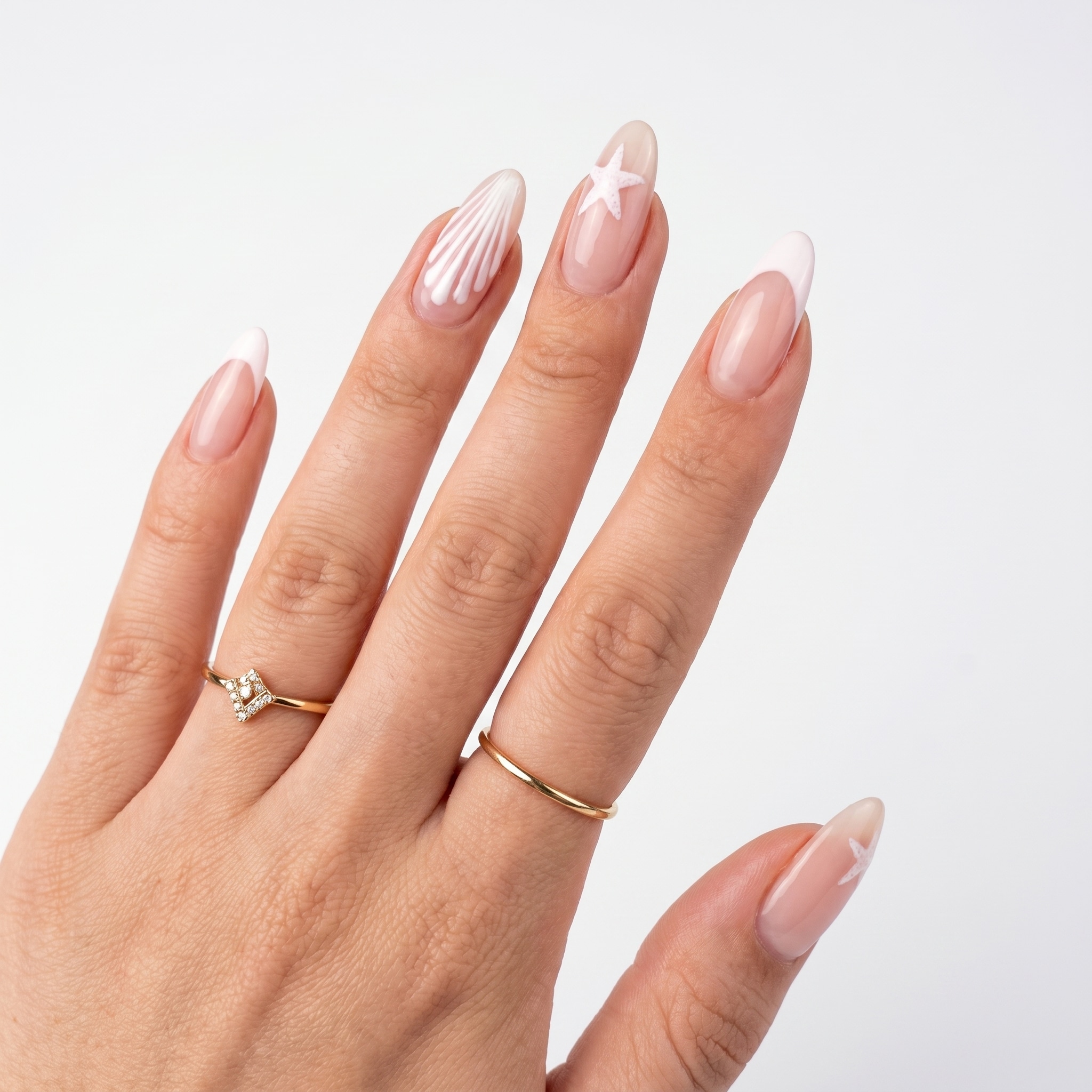 Nude almond nails with fine white swirl and tip details