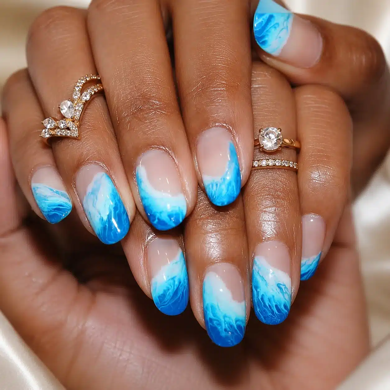 Pool-water blue ombre summer nails with pearl accents