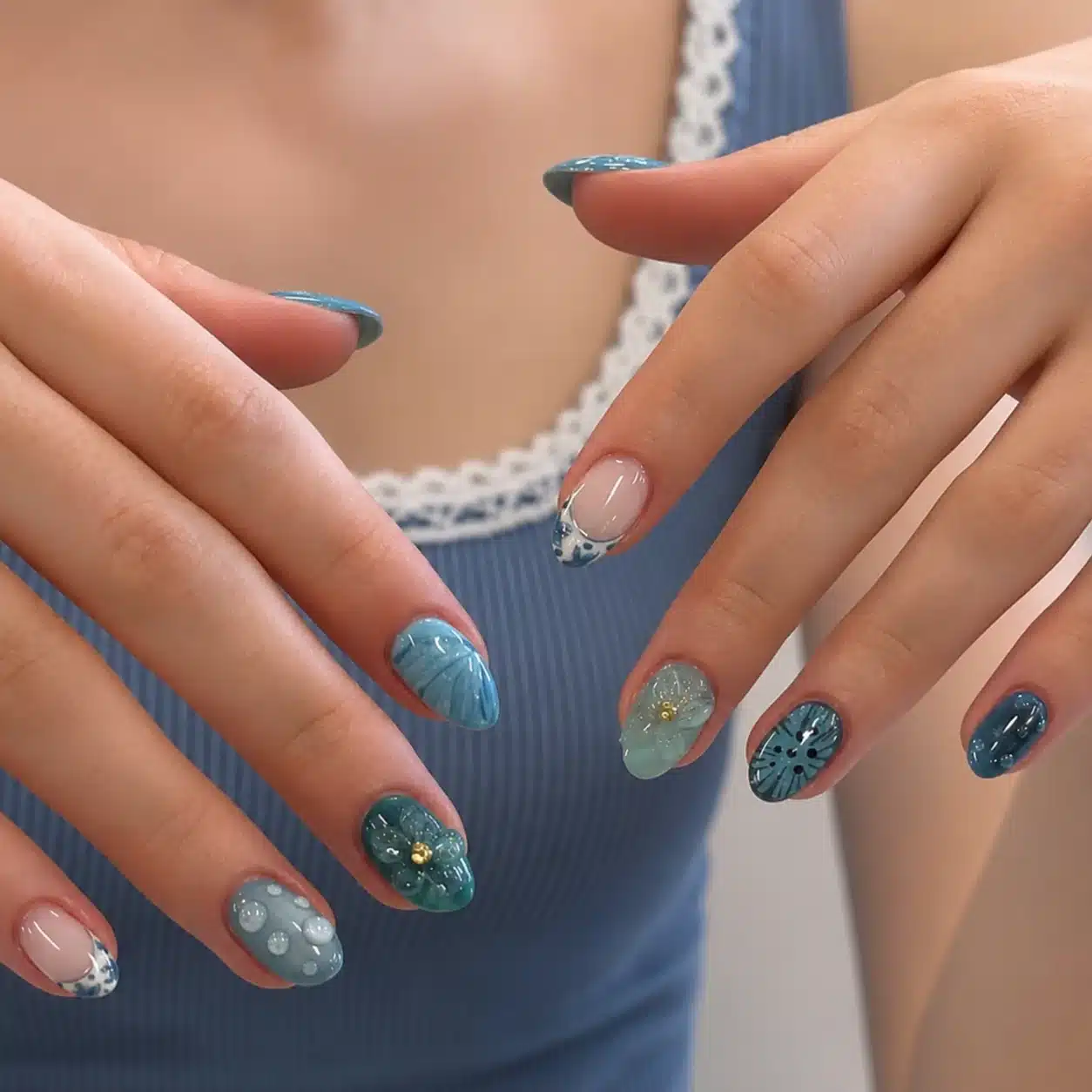 Ocean-inspired blue summer nails with aquatic details