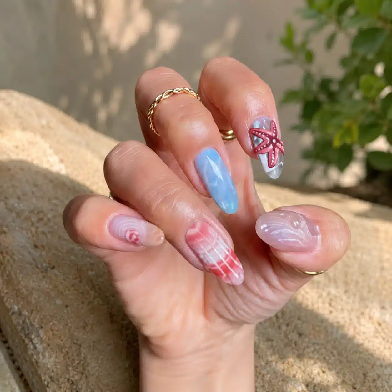 Summer Beach Nail Inspo: 11 Mermaid Manicure Ideas 7 Starfish beach nails with pearl and shell accents