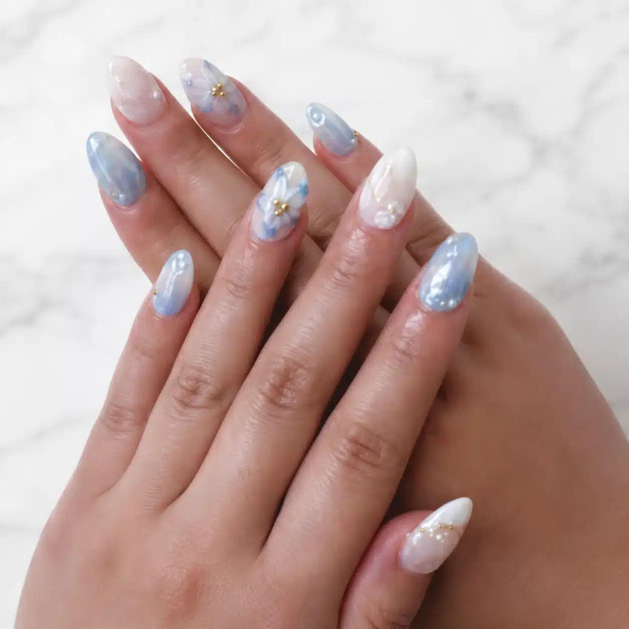 Icy baby blue nail art with soft summer details