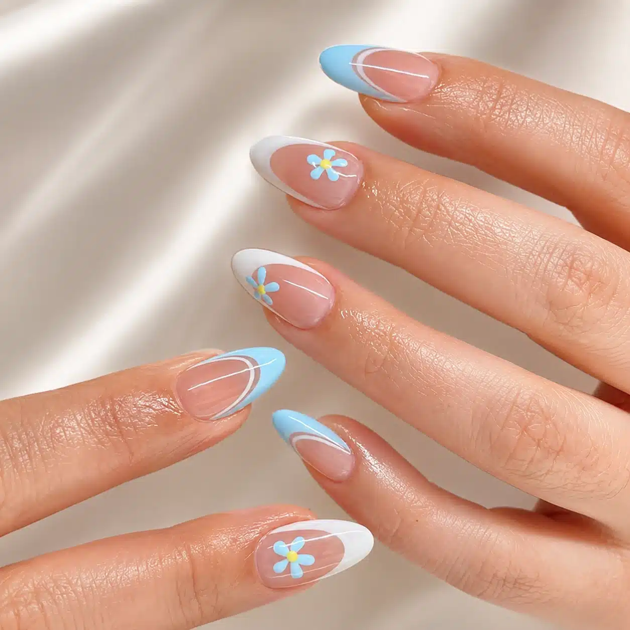 Blue aura almond nails with soft summer accents
