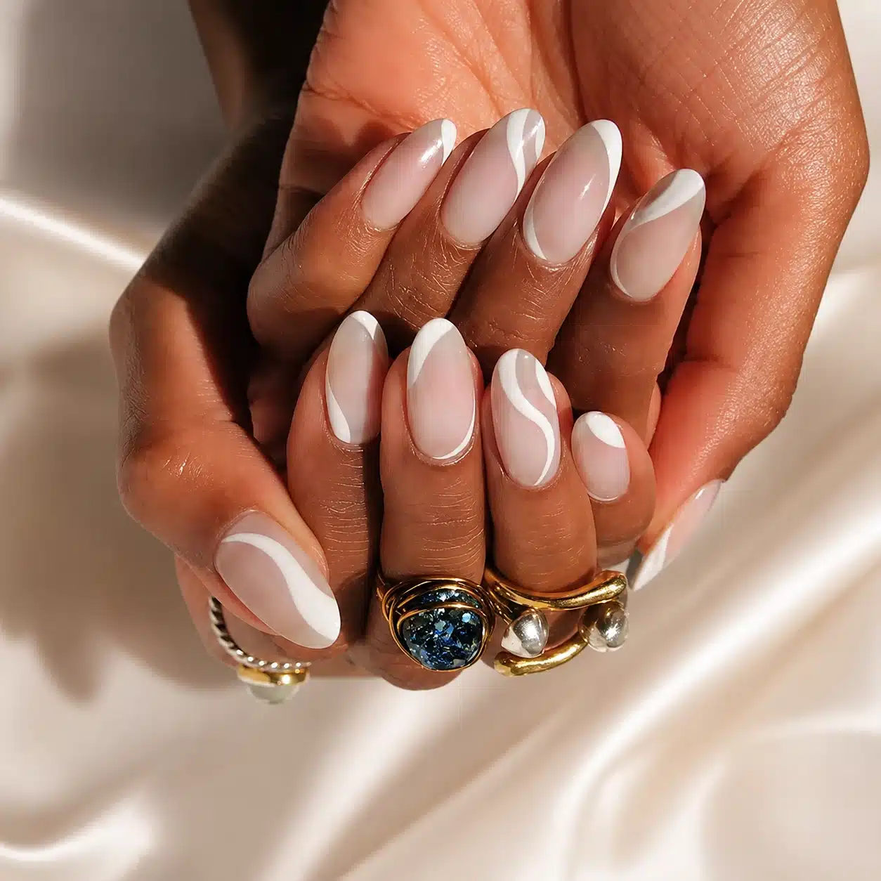 Sheer nude almond nails for a clean summer manicure