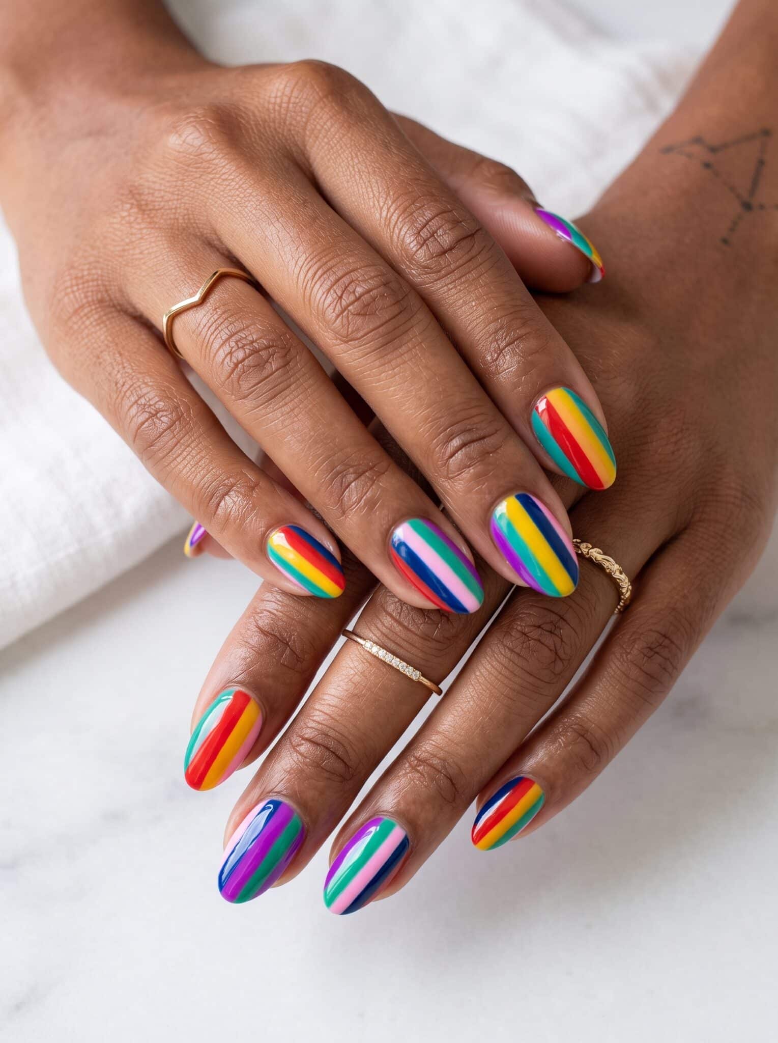 Bright fruit nail designs summer 2026 with orange, pink, yellow, and tropical details
