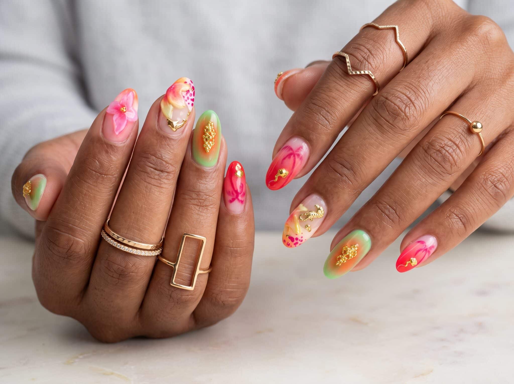 Colorful summer nail designs with orange, blue, pink, and accent nail art