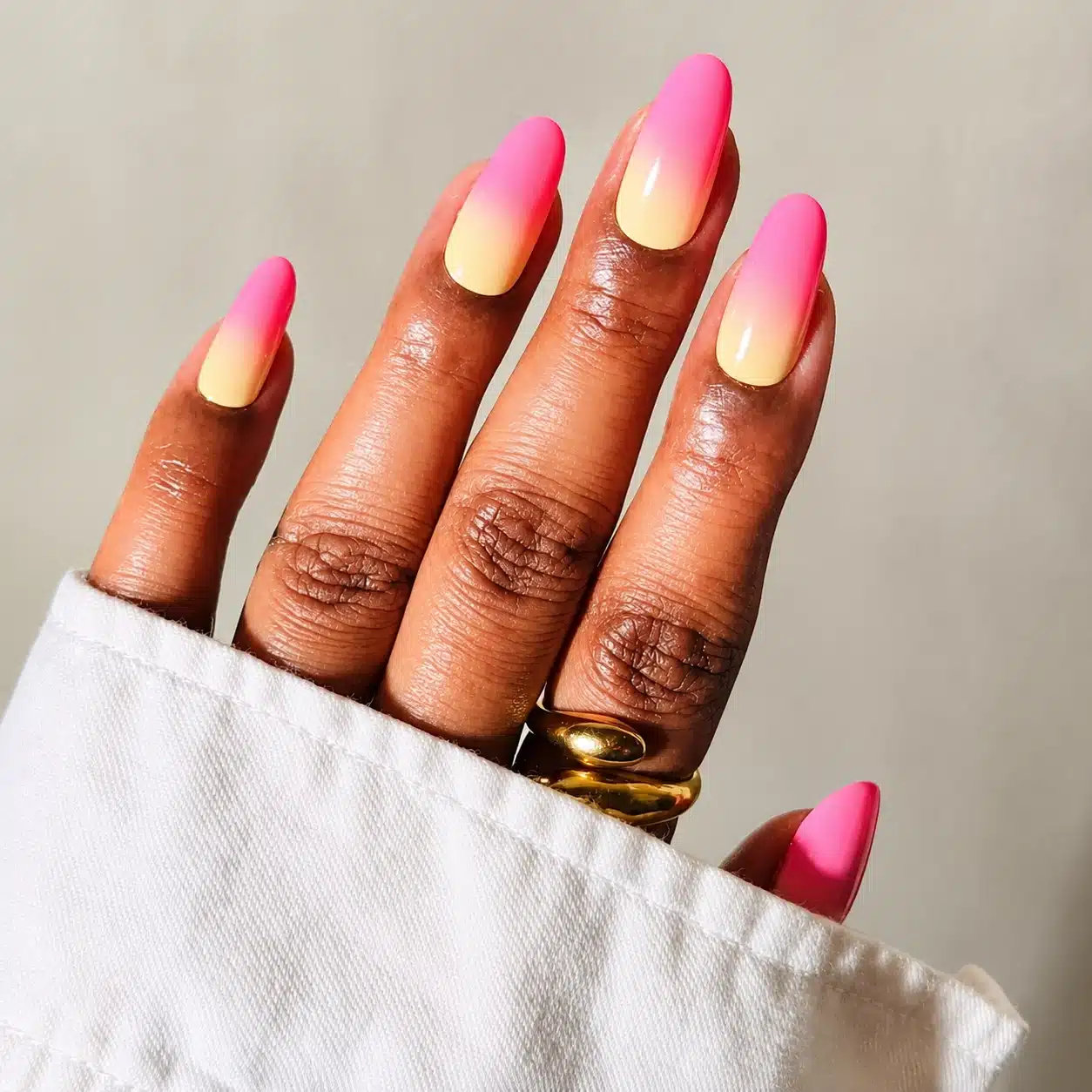 Sunset ombre gel nails in pink orange and yellow