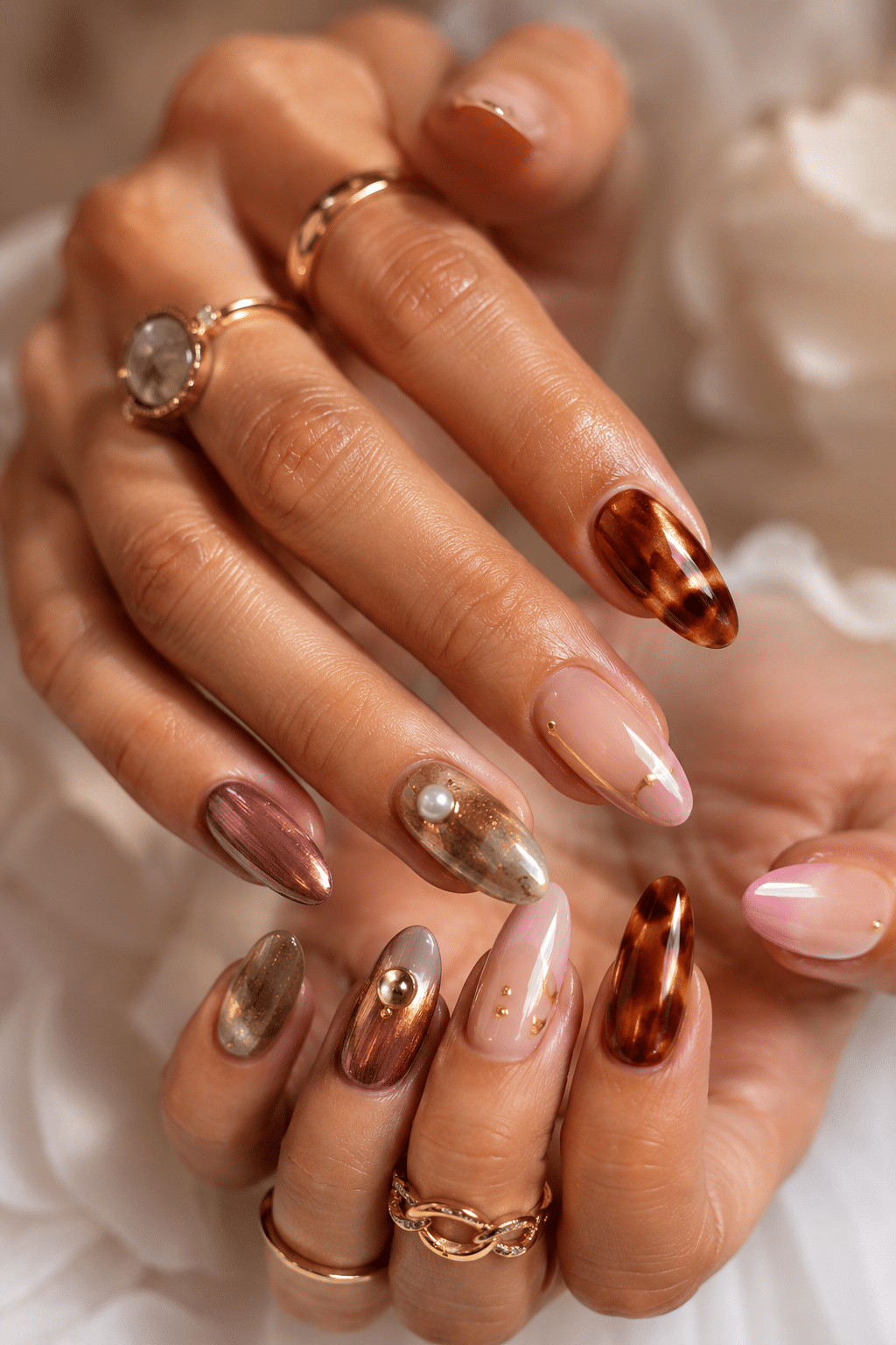 Bronze chrome summer acrylic nails 2026 with glossy metallic manicure finish