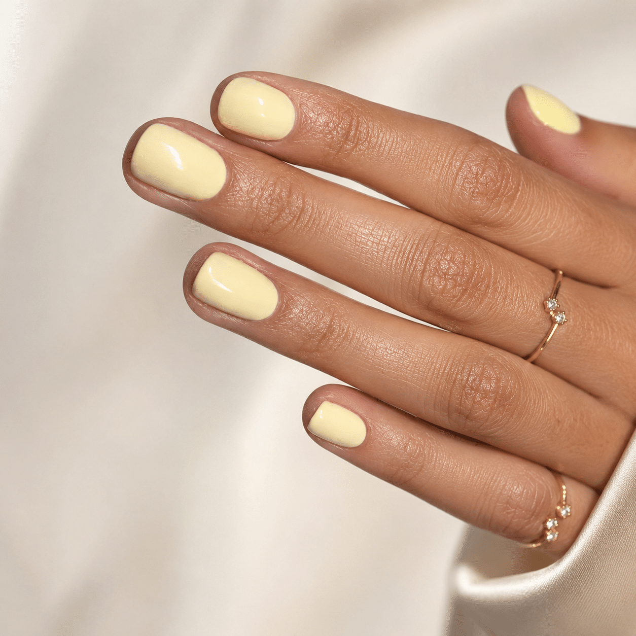 Butter yellow summer nails with a soft creamy pastel finish