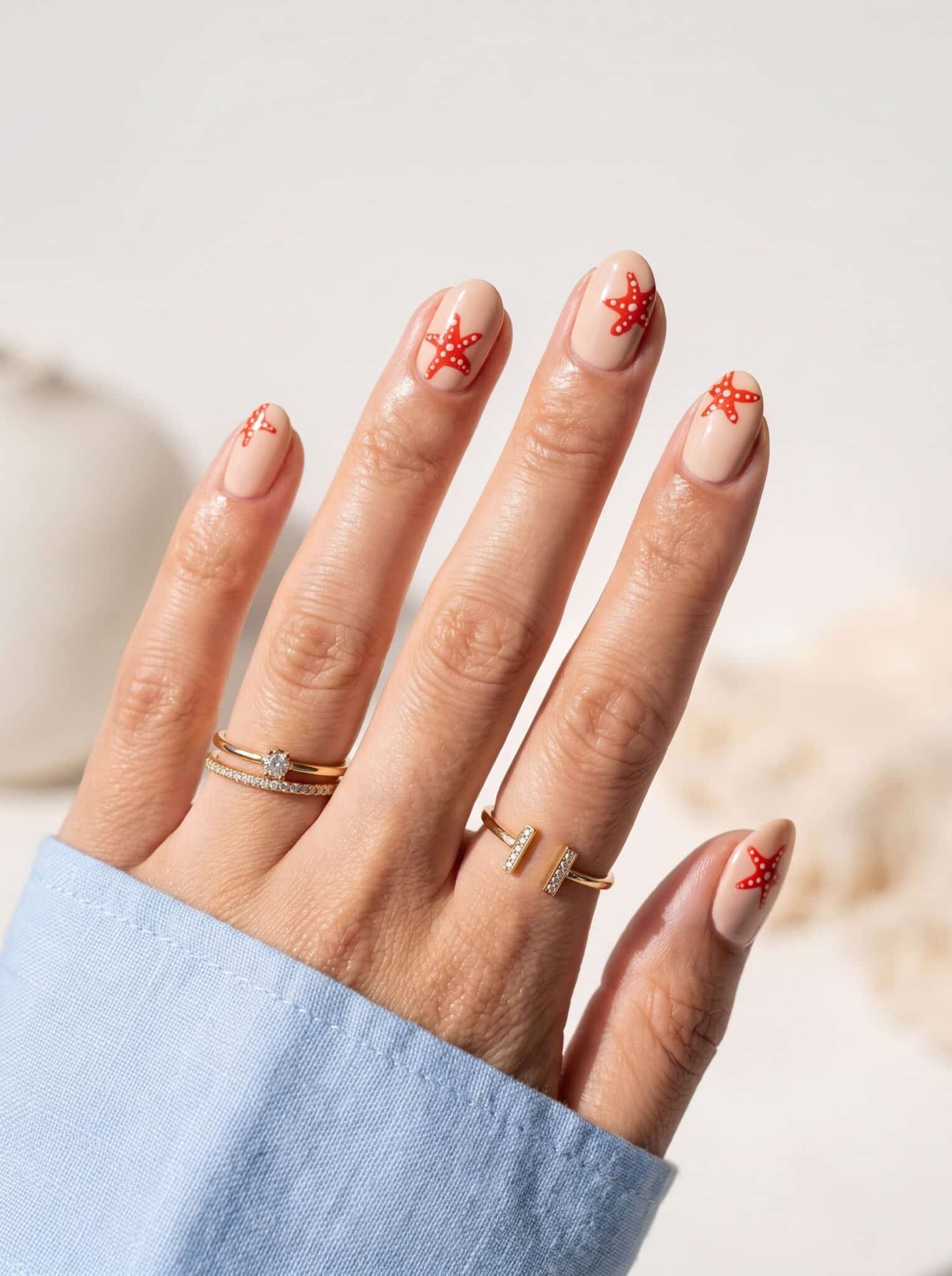 Coral flower summer nails with delicate floral accents