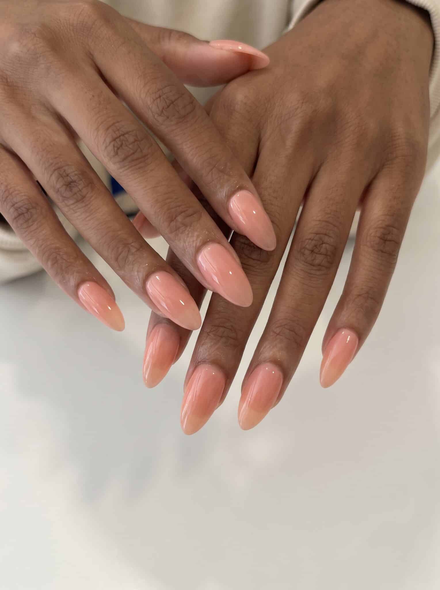 double dots neutral nails with pink nude base and tiny blue accents