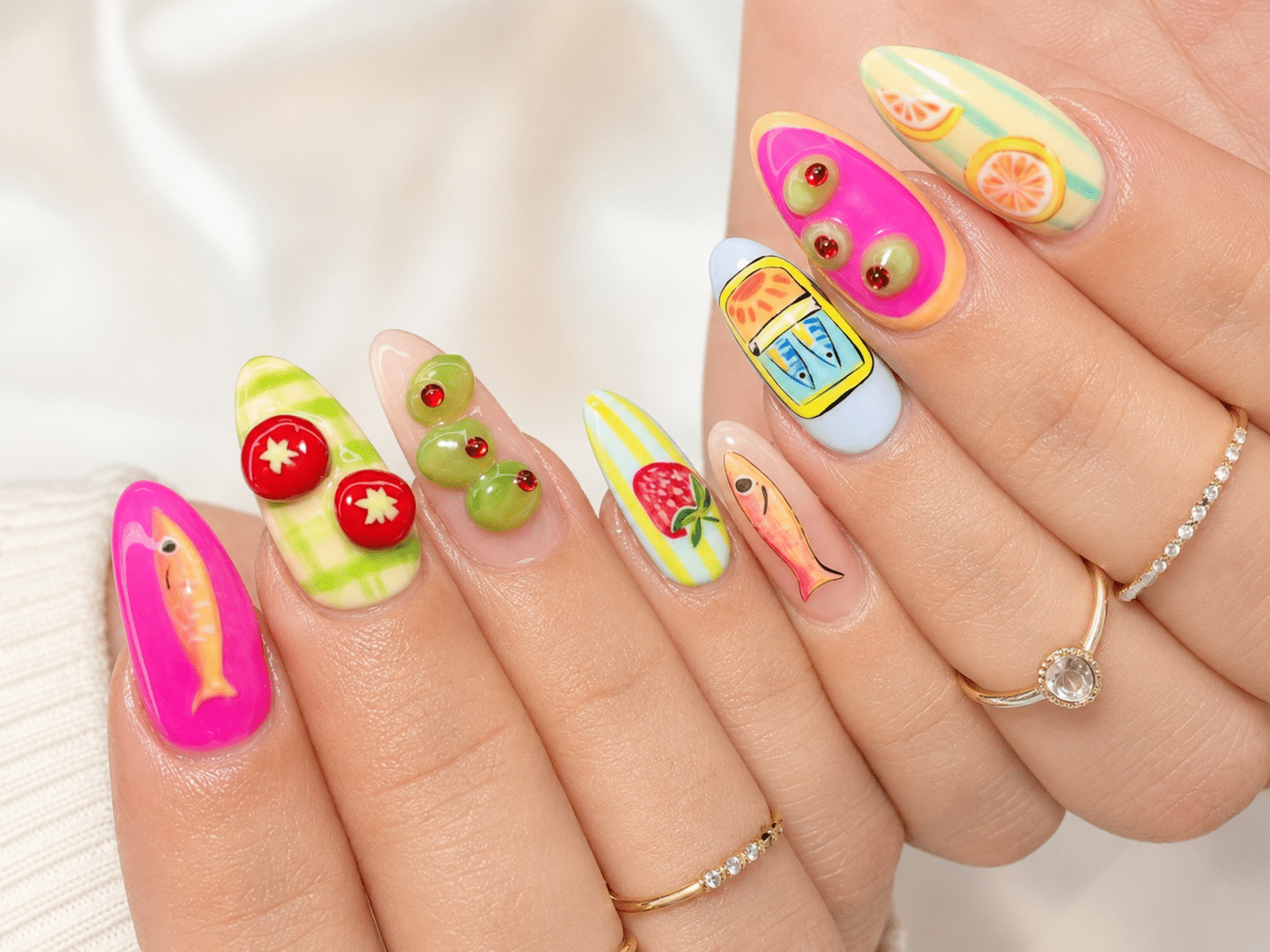 Fruit punch summer nails with bright pink and tropical nail art
