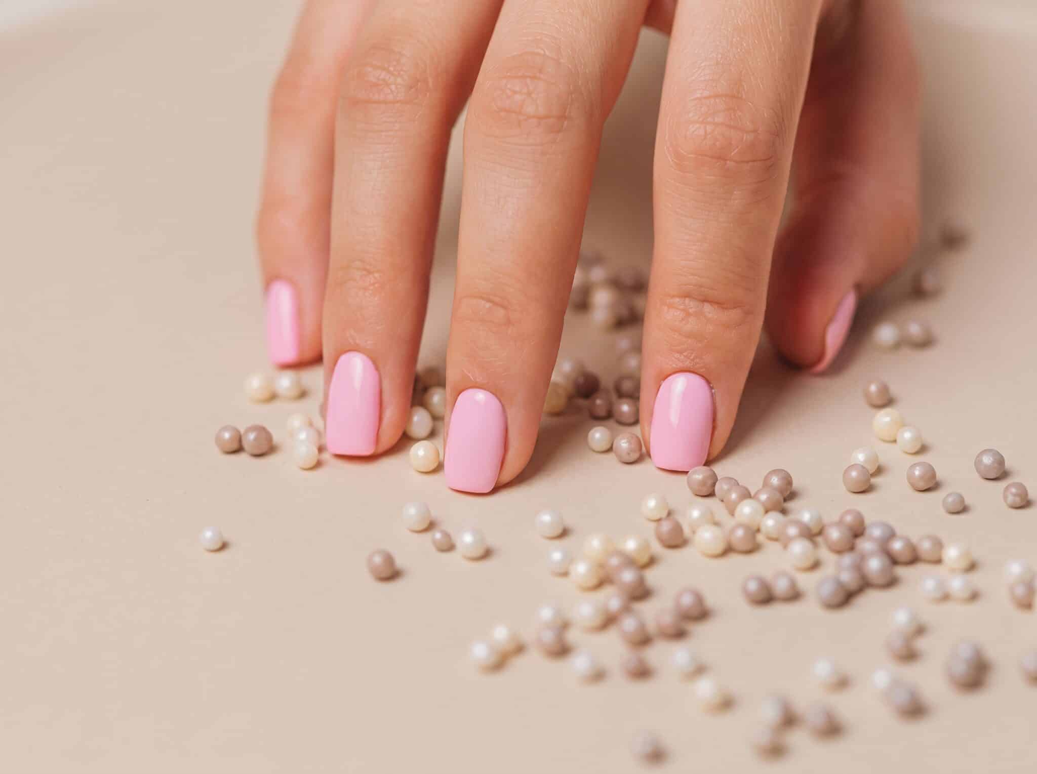 polka dot back to school nails with red dotted manicure and glossy finish
