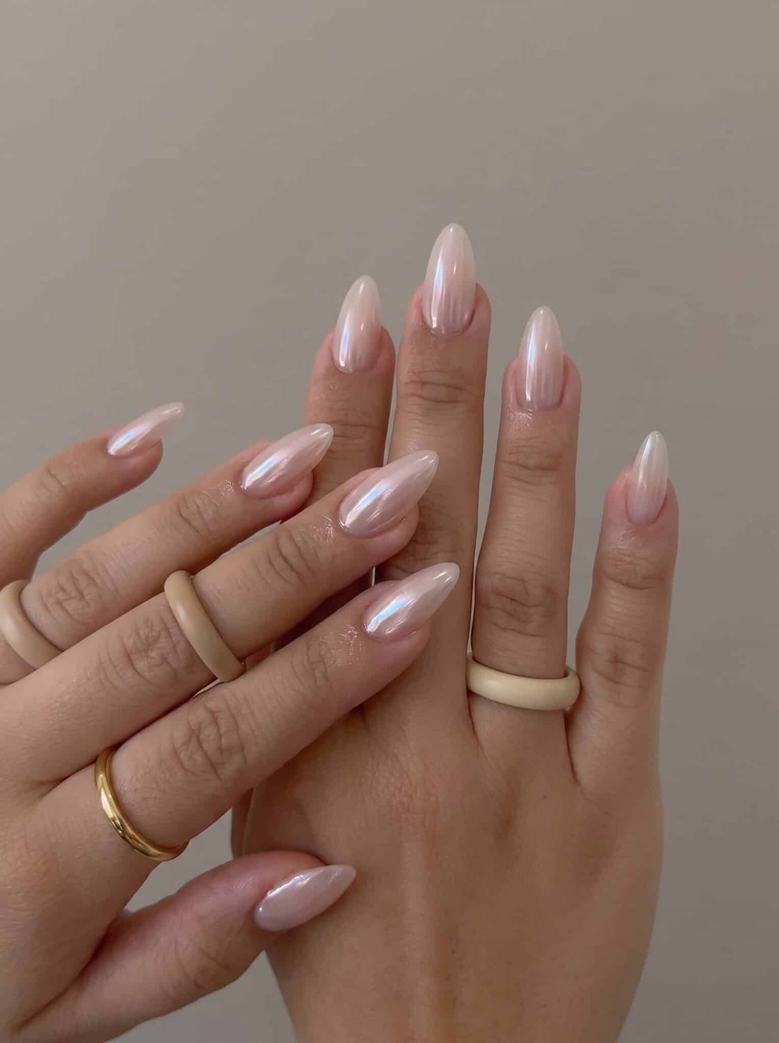 sandy shimmer neutral nails with nude polish and golden summer sparkle
