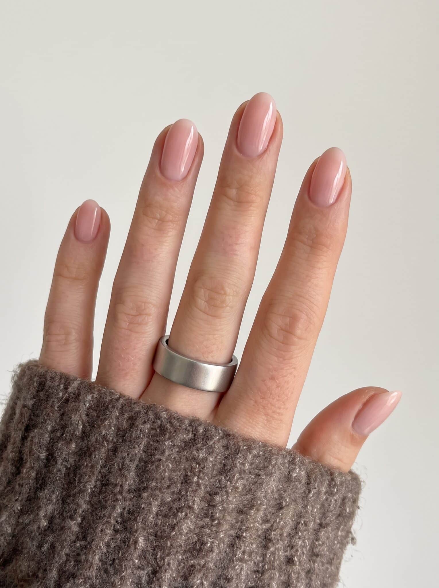 sheer peach jelly nails with glossy translucent summer polish