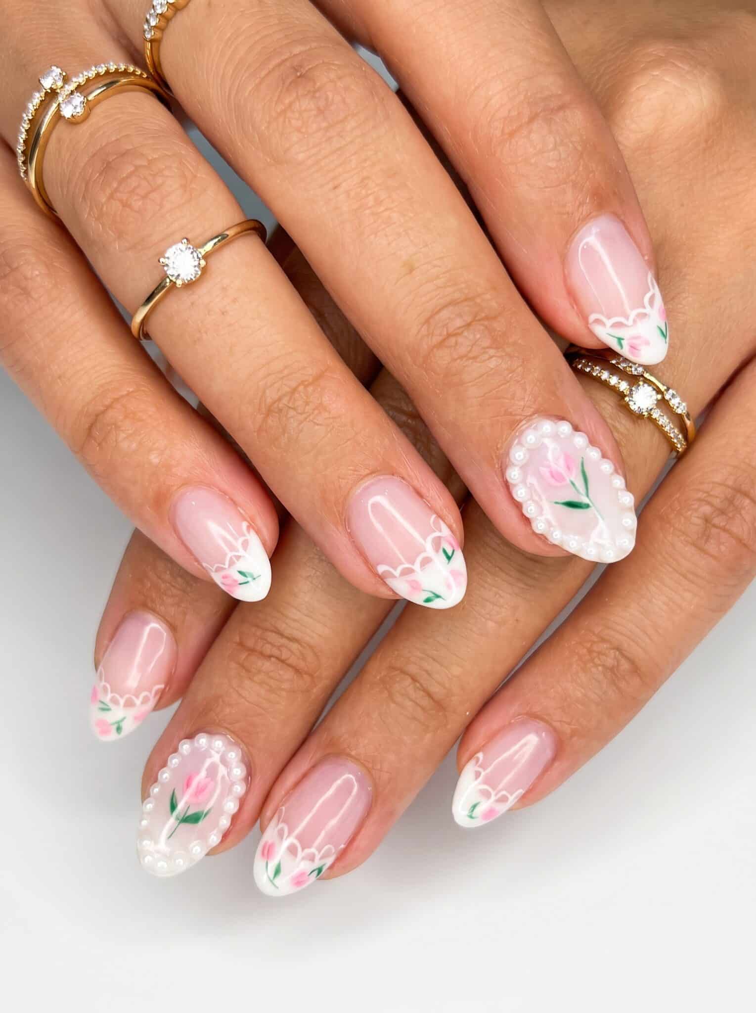 Milky white summer nails with soft floral accent details