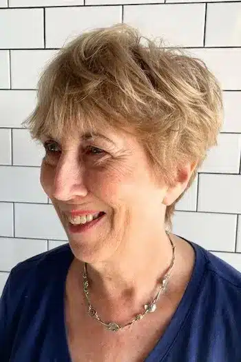 Pixie Haircuts for Women Over 60 With Fine Hair - Tousled Golden Pixie With Bangs Haircut