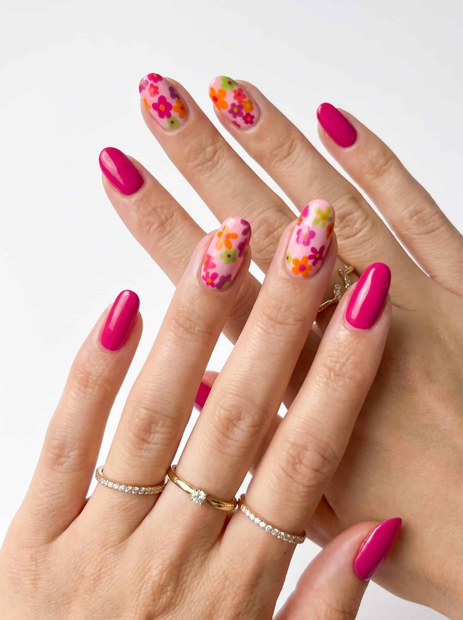 Nude summer nails with white daisy flower accents and tiny yellow centers
