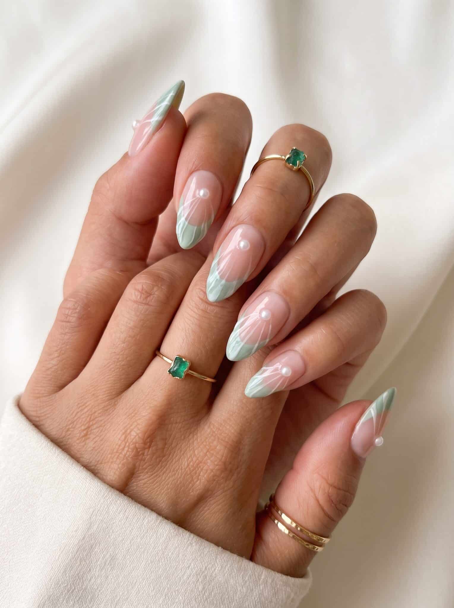 Pastel swirl nail designs summer 2026 with pink, mint, lavender, and soft abstract lines