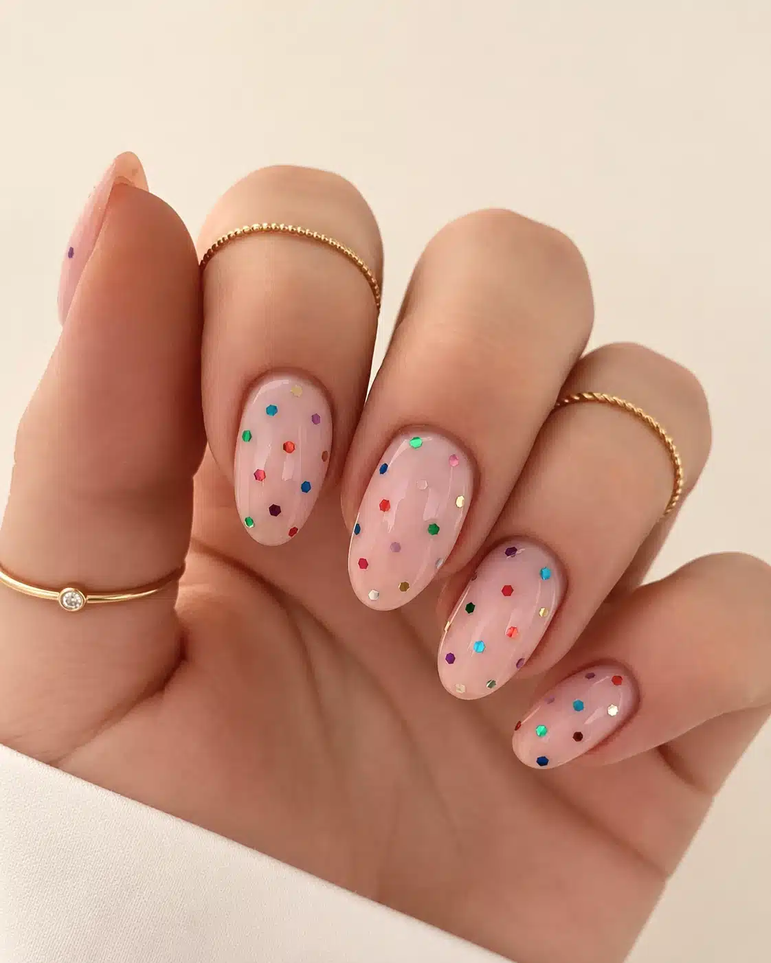 Short pink confetti birthday nails