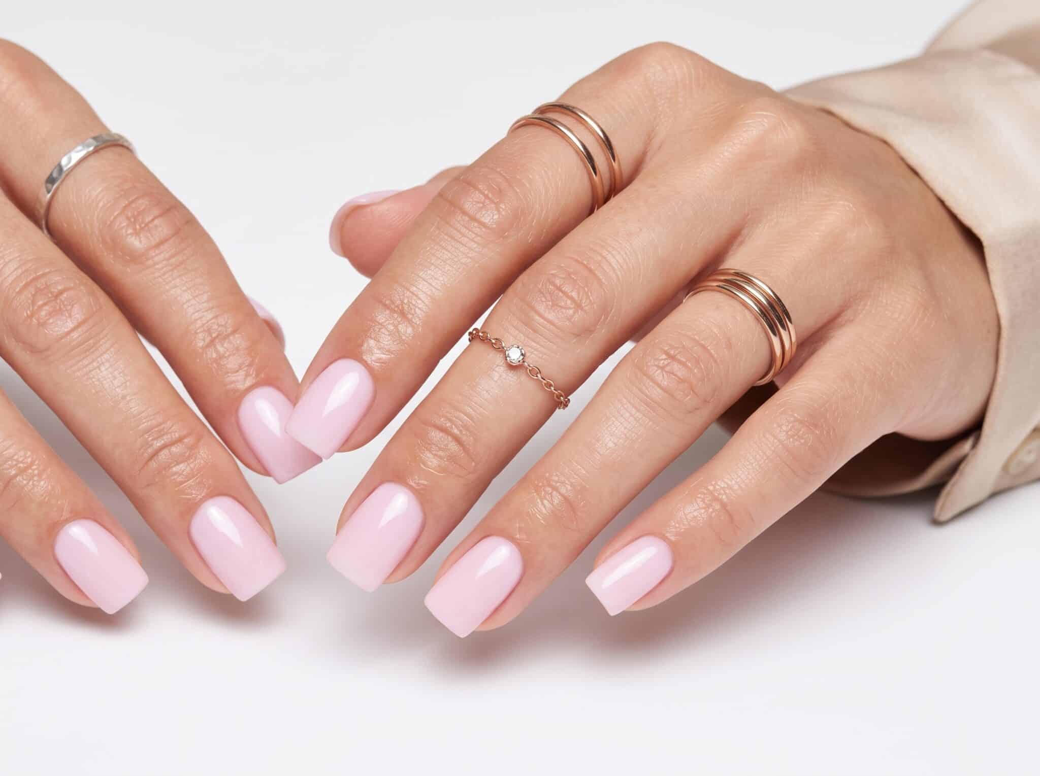 Soft pink glossy shimmer nails with delicate summer details