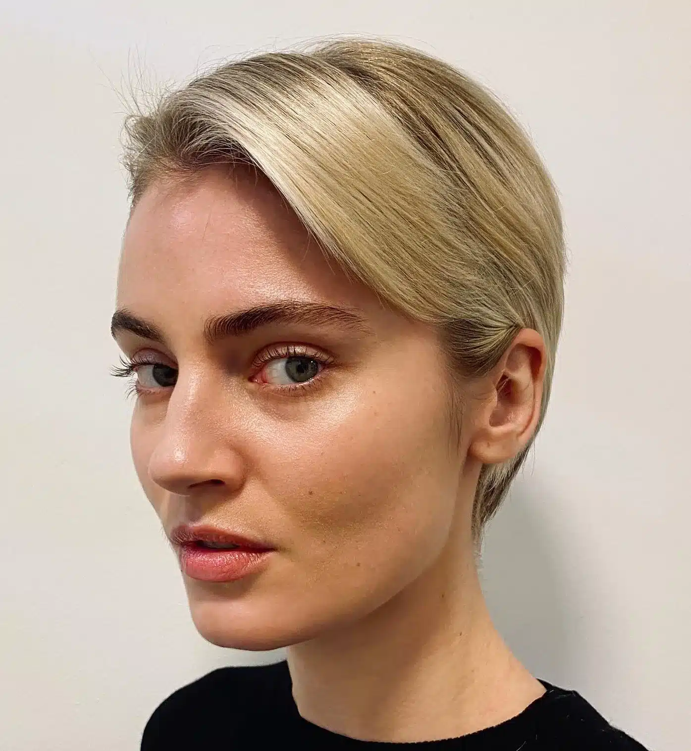 24 Short Hairstyles to Keep Your Look on Trend in 2026 21 Sleek pixie with side-swept bangs