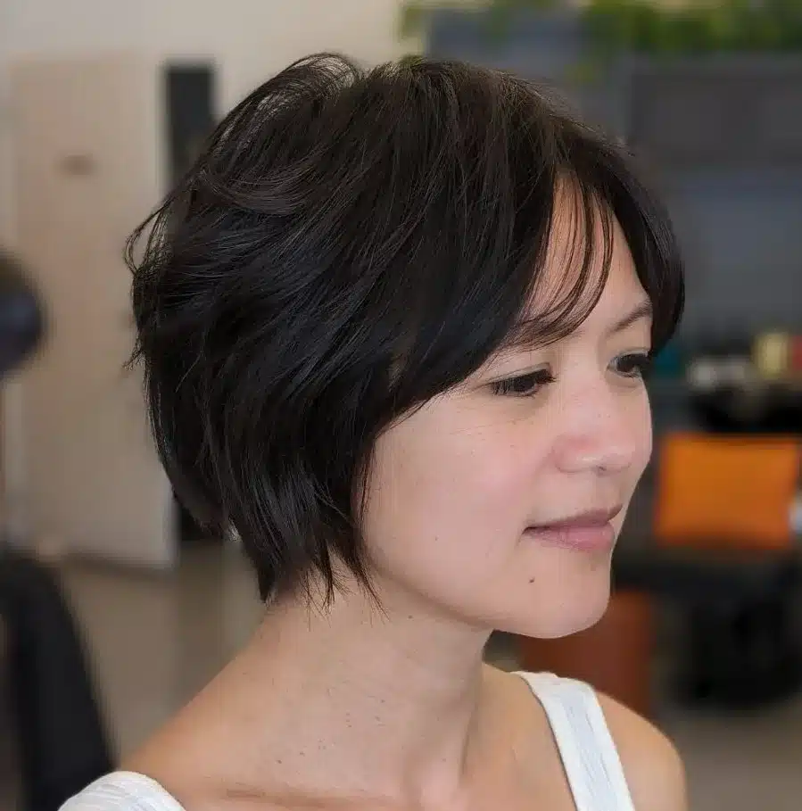24 Short Hairstyles to Keep Your Look on Trend in 2026 5 Chin-length feathered bixie haircut