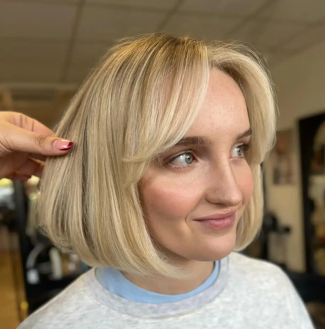 24 Short Hairstyles to Keep Your Look on Trend in 2026 7 Curled-under bob with soft curtain bangs
